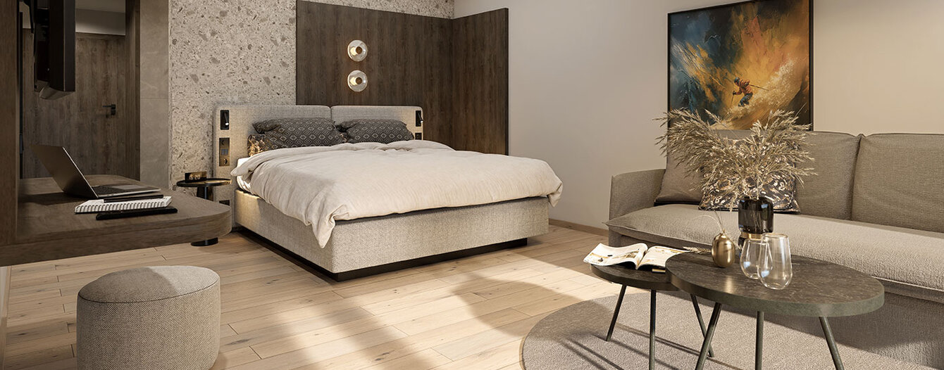 Ein modernes Schlafzimmer mit einem großen Bett, neutralen Tönen, einem hellen Holzboden, einem grauen Sofa, runden Couchtischen, einem runden Teppich, Wandkunst und dekorativer Beleuchtung an der Rückwand.